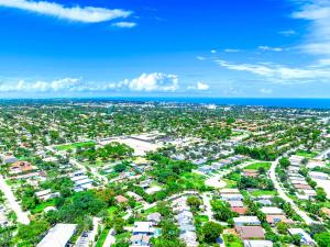 an aerial view of a city with houses and the ocean at Sunset Haven with Saltwater Pool & mins to beach in Delray Beach