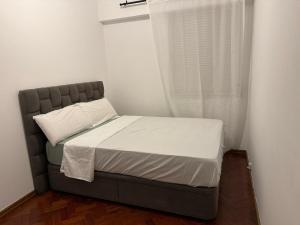 En eller flere senge i et værelse på Apartamento T2 Odivelas remodelado