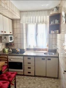 Kuchyň nebo kuchyňský kout v ubytování La casina del Reloj con vistas al mar