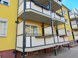 a building with a spiral staircase on the side of it at Ferienwohnung Lion in Oschersleben