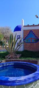 Bazén v ubytování Hotel y Cabañas El Taxho nebo v jeho okolí