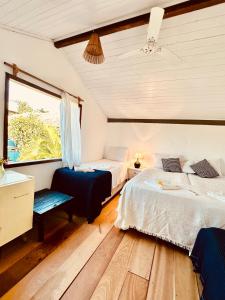 En eller flere senge i et værelse på Casa Saravá na Pousada Ziriguidüm