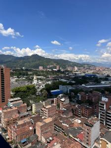 an aerial view of a city with buildings and mountains at Sabaneta, aparta Loft, excelente Ubicacion, Wifi in Sabaneta