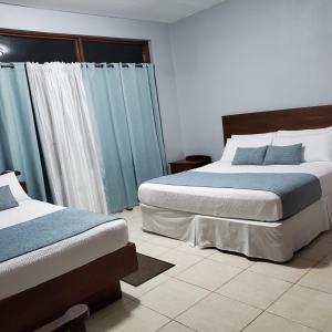 Ένα ή περισσότερα κρεβάτια σε δωμάτιο στο Hidden Secret