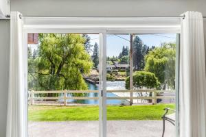 a window view of a river from a house at Riverfront Studio in Downtown Bend in Bend