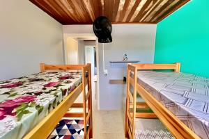 En eller flere senge i et værelse på #MaTinhoSéMassa# Com 02 Quartos Top C/ TV e Wi-Fi