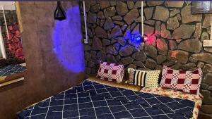 En eller flere senge i et værelse på Stone Villa Vagamon