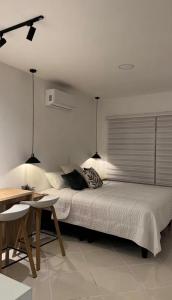 Postel nebo postele na pokoji v ubytování Aparta estudio Luxury