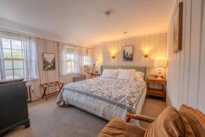 a bedroom with a bed and a tv in it at Franconia Inn in Franconia +96 photos