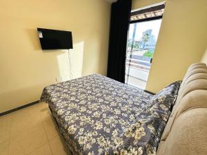 Et tv og/eller underholdning på Condomínio Orla de Atalaia