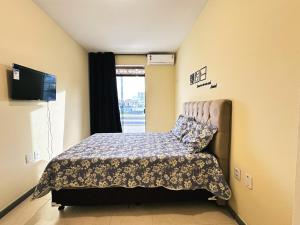 En eller flere senge i et værelse på Condomínio Orla de Atalaia