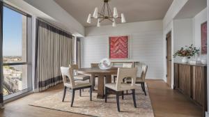 a dining room with a table and chairs at Four Seasons New Orleans in New Orleans