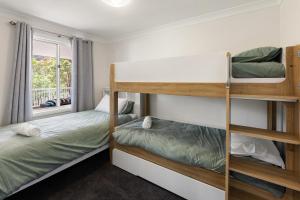 En eller flere senge i et værelse på Valley View Retreat