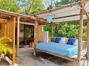 a bed under a pergola on a patio at La Casa del Conde in Playa Naranjo +67 photos