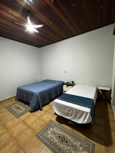 En eller flere senge i et værelse på Chácara Eco Ville + 6 billeder