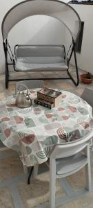 a table with a tea pot on top of a bed at Romantica in Brindisi