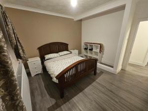 En eller flere senge i et værelse på Maes Hyfryd