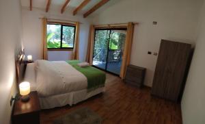 Postel nebo postele na pokoji v ubytování Cabañas Buraleo