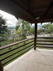 a balcony with a view of a city at Interior beach house in Bombinhas! in Bombinhas