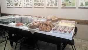 a table with a buffet of food on it at Penzion Koniklec in Jestrabi V Krkonosich