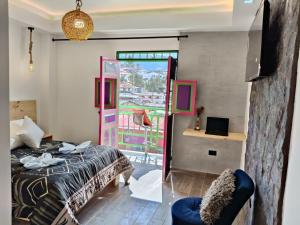 a bedroom with a bed and a window with a view at La Marteja in Salento