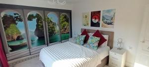 En eller flere senge i et værelse på Place of the Goddess