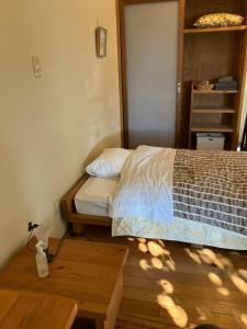 Postel nebo postele na pokoji v ubytování Green House Tsukuba Studio