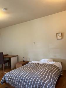 Postel nebo postele na pokoji v ubytování Green House Tsukuba Studio