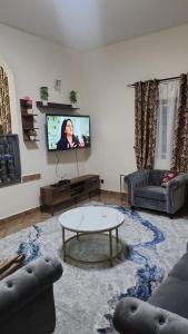 TV/trung tâm giải trí tại Cozy Home