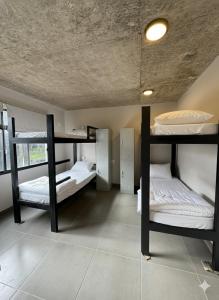 En eller flere senge i et værelse på Casa mansa hostel