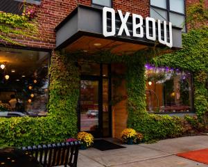 a building with a sign that reads oxbow at The Oxbow Hotel in Eau Claire