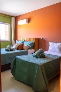 En eller flere senge i et værelse på Apartamento em Cabo Frio Proximo a Praia do Forte