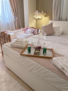 a tray of food sitting on a bed at Queen Nefertari-Luxury Apartment Near Pyramids Giza in Cairo