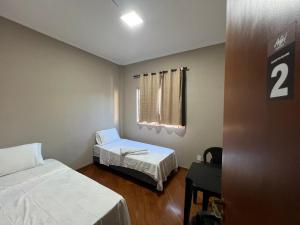 Giường trong phòng chung tại Casa Huus