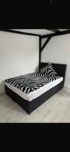 Ένα ή περισσότερα κρεβάτια σε δωμάτιο στο 1 Zimmer Häuschen