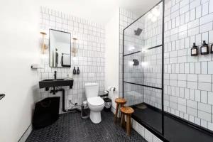 a bathroom with a toilet and a sink at Symons Block Suite 5 in Spokane