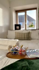 a tray with christmas decorations in a living room at Modern 2-Bed Flat, Spacious, near Harry Potter Studio in Watford