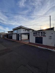 a building with a hotel motel sign on the side of it at Hotel Norte Sul in Campo Grande