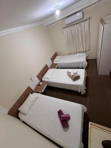 Giường trong phòng chung tại Hotel Norte Sul