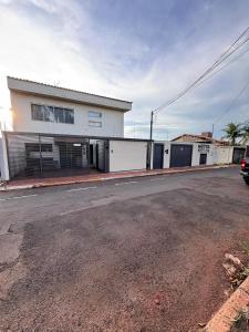 an empty street in front of a white building at Hotel Norte Sul in Campo Grande +37 photos