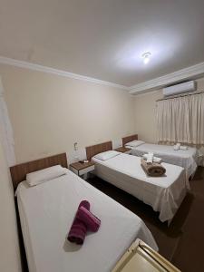 Giường trong phòng chung tại Hotel Norte Sul