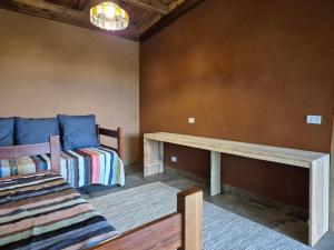 a living room with a couch and a table at Casa Solar in São Bento do Sapucaí