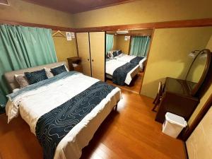 En eller flere senge i et værelse på Nikko Central GOKO STAY