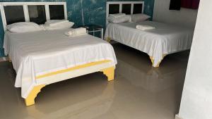 Postel nebo postele na pokoji v ubytování Hotel Ryluc