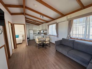a living room with a couch and a table at Great Western Motel in Great Western