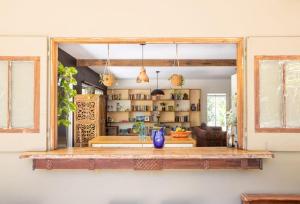 a living room with a counter and a window at Honeybird Hideaway in Crabbes Creek