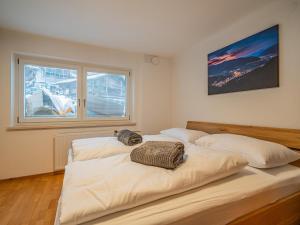 Postel nebo postele na pokoji v ubytování Alpen Haus Maria