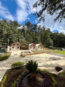 a house in a subdivision with a driveway at Bungalows Bosque Selah in Nebaj