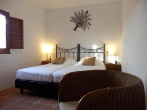 En eller flere senge i et værelse på Casa Azafranes - Boutique B&B - Arenas