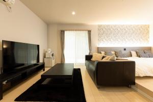 Et tv og/eller underholdning på ビジネス&長期ステイコテージ